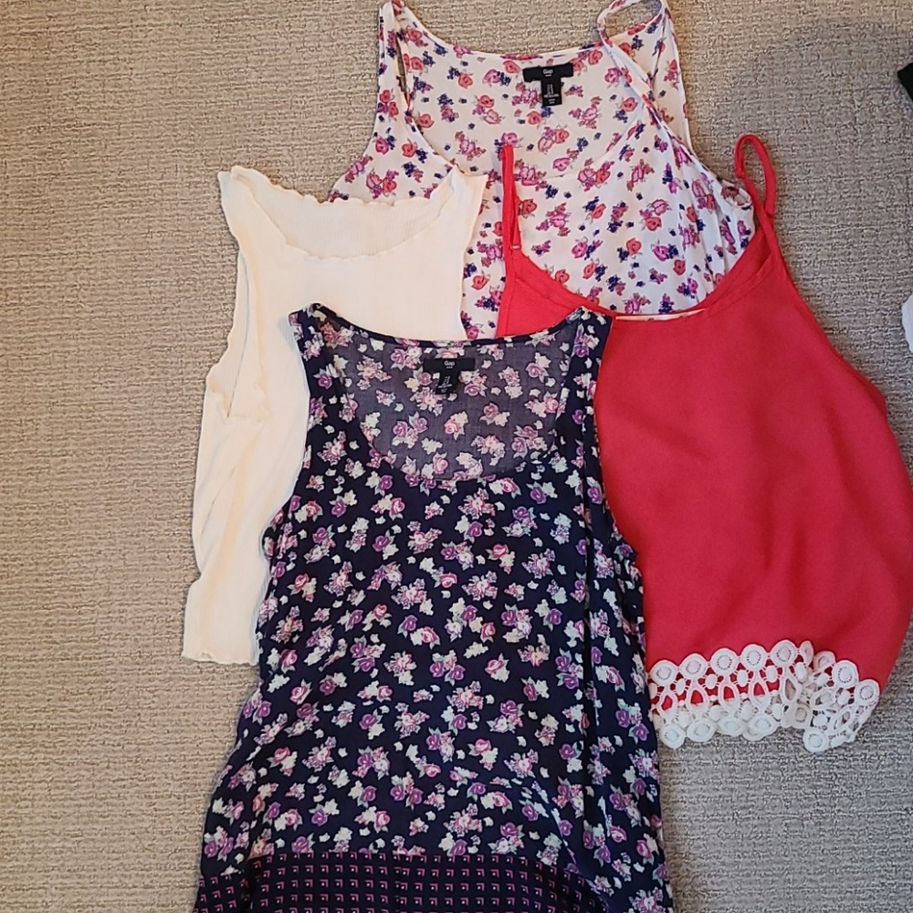 4 size small tank tops in great condition.